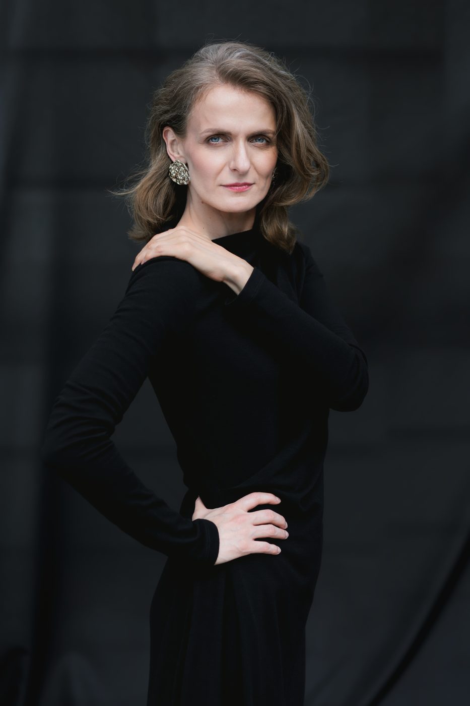 Monika Valkunaite in a black dress